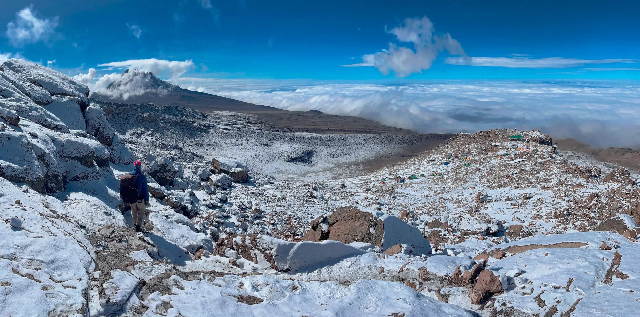 the magnificent view of snow and clouds at Kilimanjaro peak after trekking for 5 days