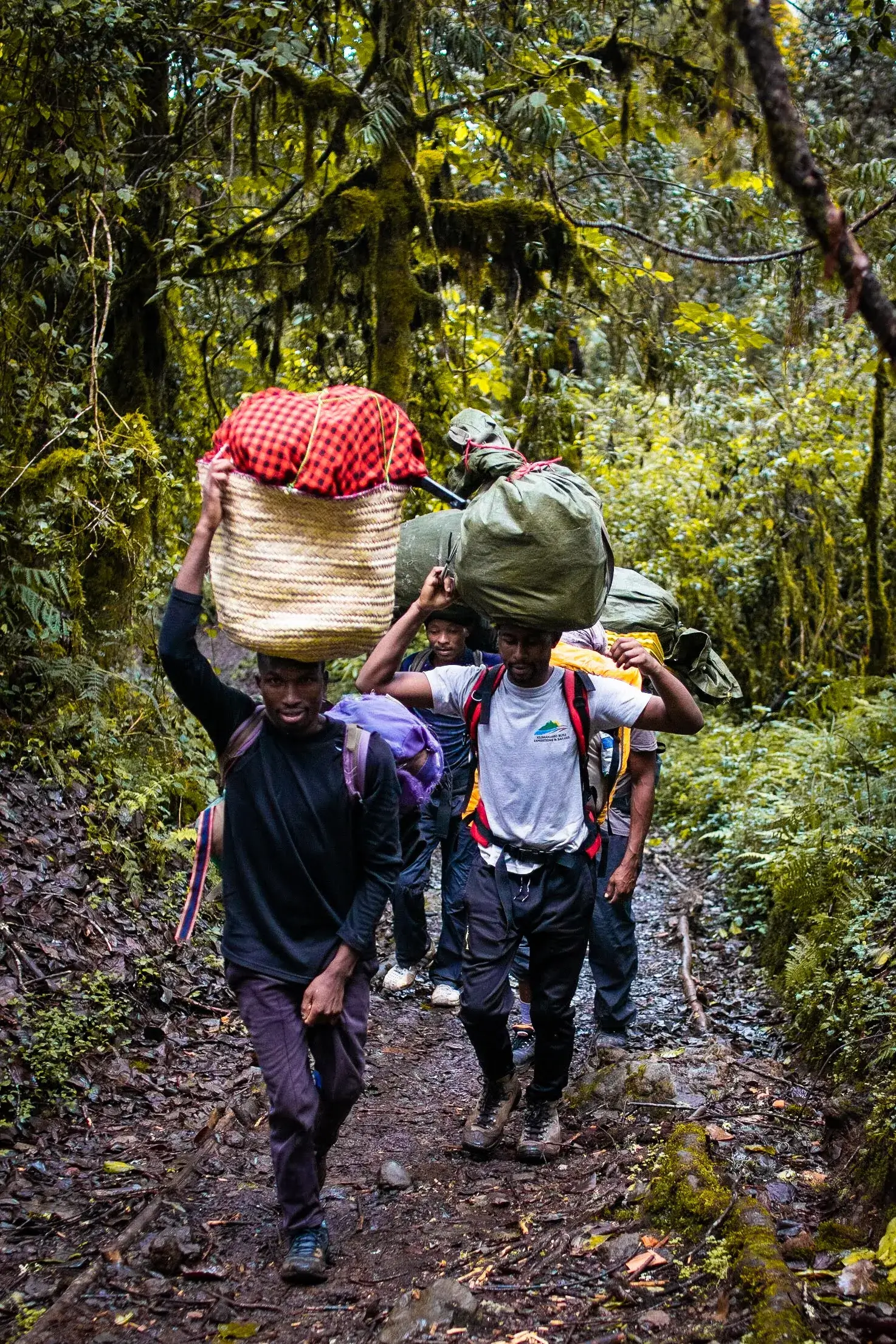 Group of afrikan adventure crew carrying utilities for our trekking companions