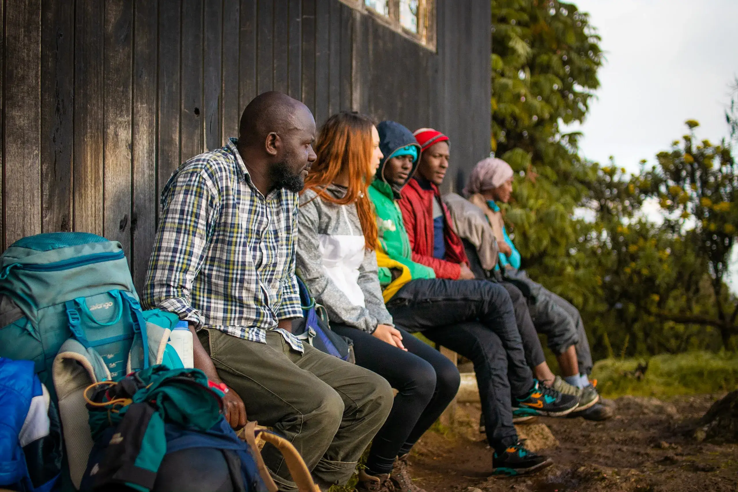 Our travelers, who are a group of friends posing for a picture while trekking Kilimanjaro